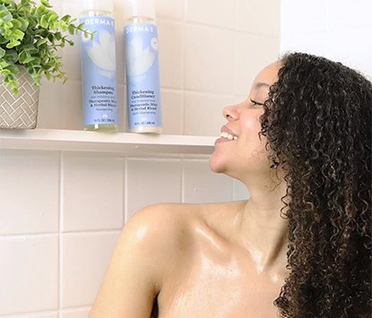 Woman with 3C type curly hair in shower